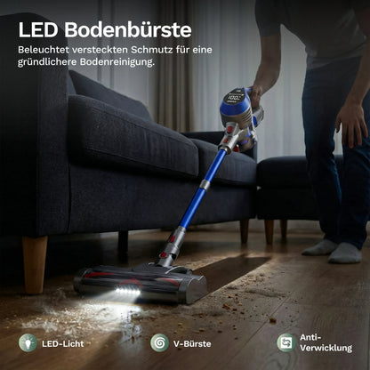 Akku-Staubsauger mit LED-Bodendüse am Sofa, blauer Griff