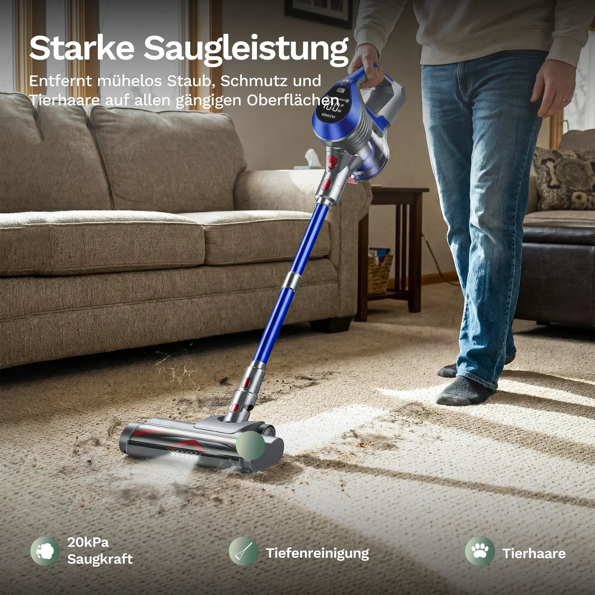 Akku-Staubsauger reinigt Sofa und Boden, blauer Griff mit Bodendüse